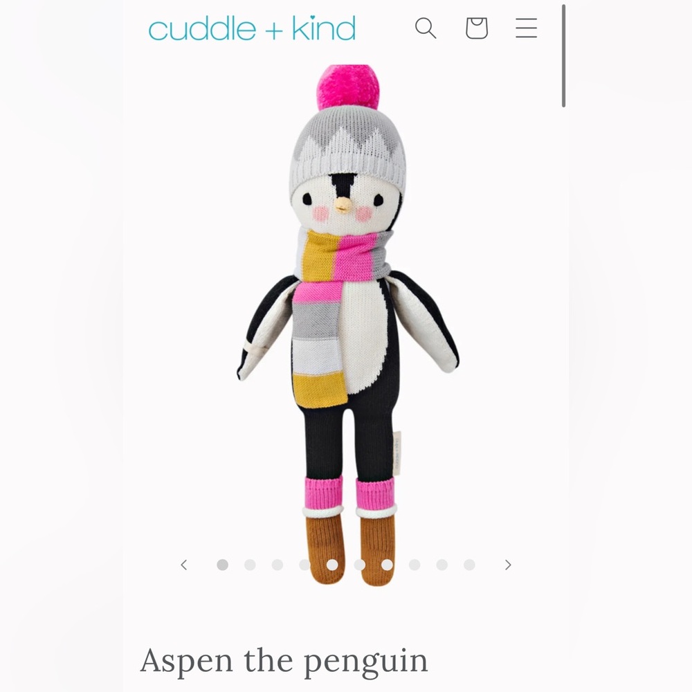 Cuddle and Kind Aspen the penguin hand knit doll. This is the small doll at 16”.